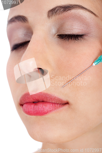 Image of Close up shor of a  pretty girl getting Botox injection