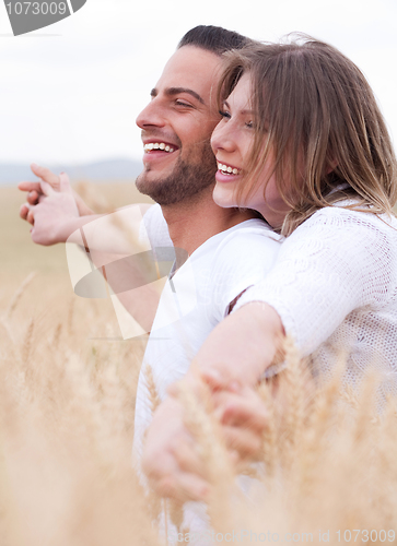 Image of Happy young couple smiling