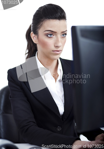 Image of Serious business woman working in computer