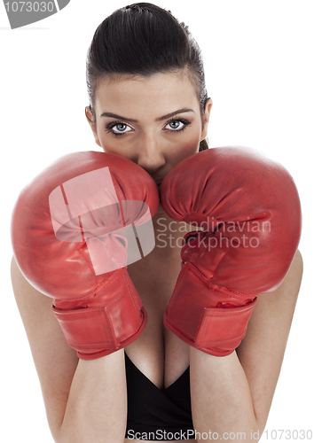 Image of Woman covering her mouth with red gloves