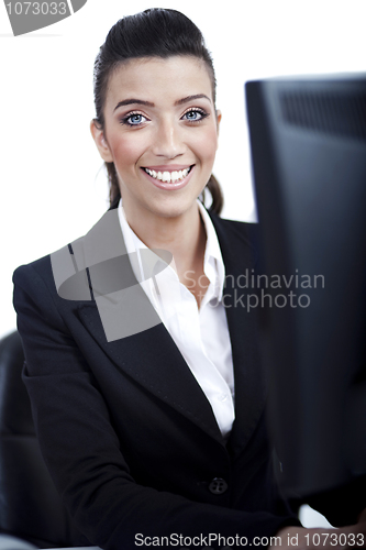 Image of Closeup of young business woman infront of the computer