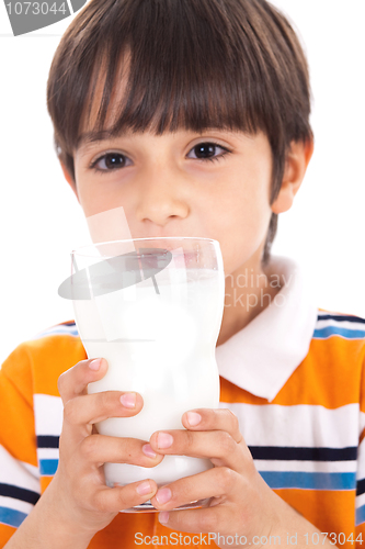 Image of Happy kid drinking glass of milk