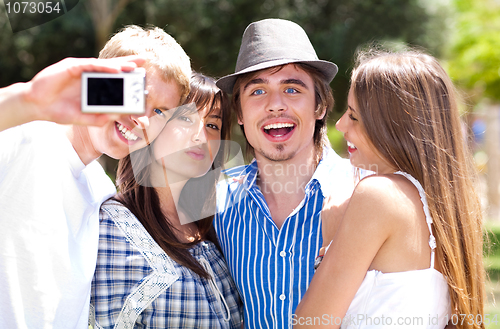 Image of Group of College students standing together taking a self portrait