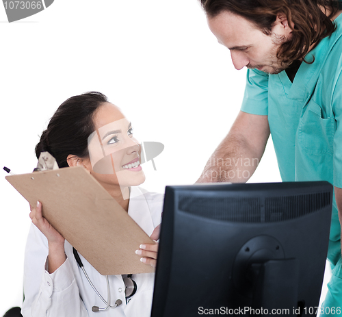 Image of Doctor explains patient record to the male nurse