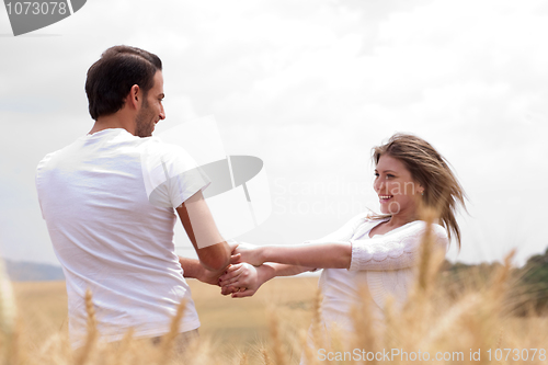 Image of Loving handsome couple playing