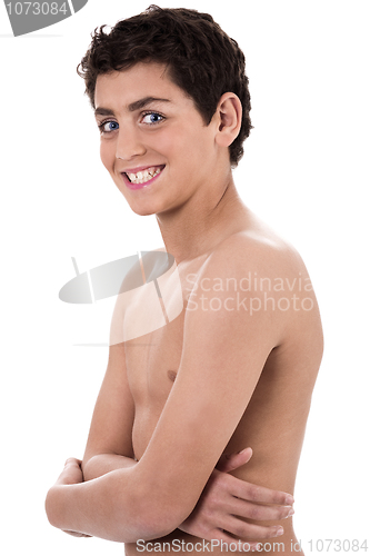 Image of Boy giving strange expression and smiling