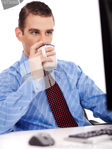 Image of Business man monitering computer