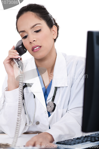 Image of Asian female doctor talking over phone