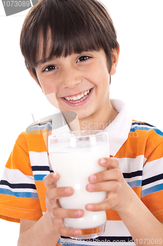 Image of Happy kid holding a glass of milk