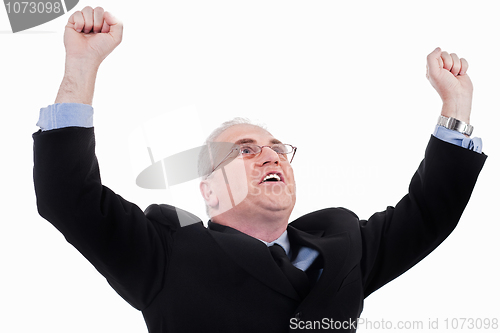 Image of Champion senior business man standing with fists clenched in victory