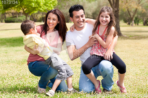 Image of Happy family enjoying in the park