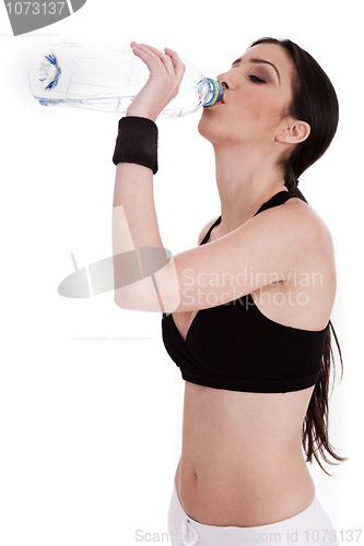 Image of fitness woman drinking water