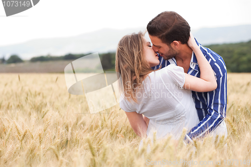 Image of Happy young Couple hugging and kissing eachother