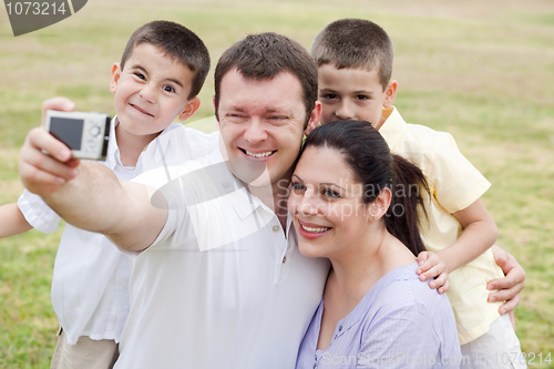 Image of Cheerful family of five taking self portrait