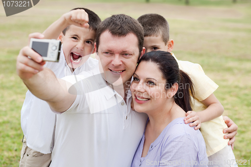 Image of Happy family pilled together and taking self portrait