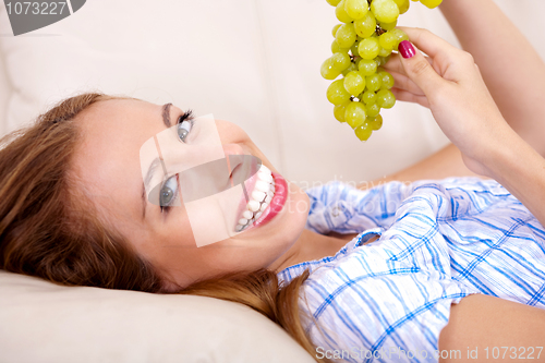 Image of Happy women with grapes