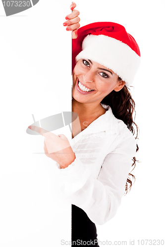 Image of Santa girl pointing the white board