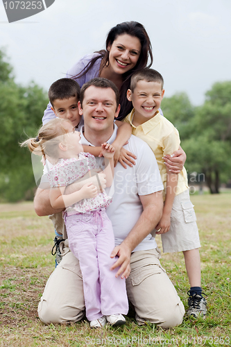 Image of Close up shot of cheerful family posing together
