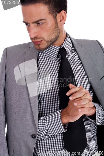 Image of Serious  business man with his half weared suit