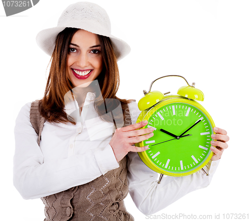 Image of stylish lady holding alarm clock