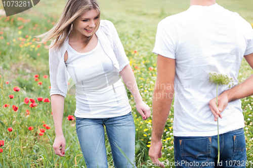 Image of boyfriend hiding a flower