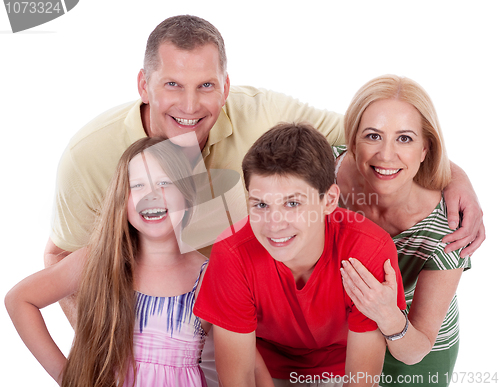 Image of Happy family smiling towards the camera