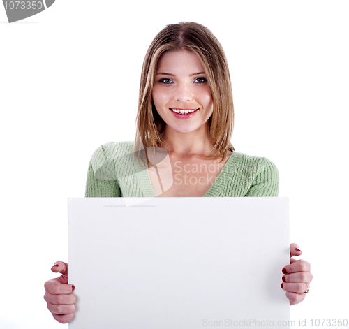 Image of Charming young girl holding white bill board