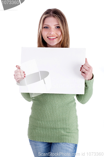 Image of Smiling young beautiful girl  holding blank white board