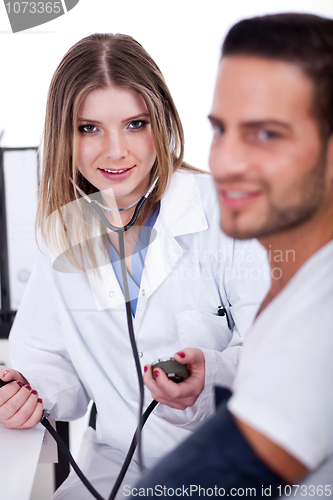 Image of Patient checking his blood pressure