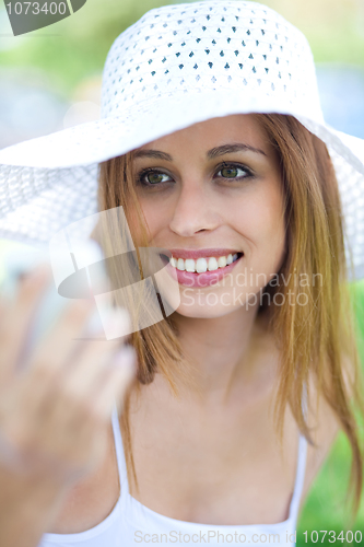 Image of Beautiful women looking at mobile phone