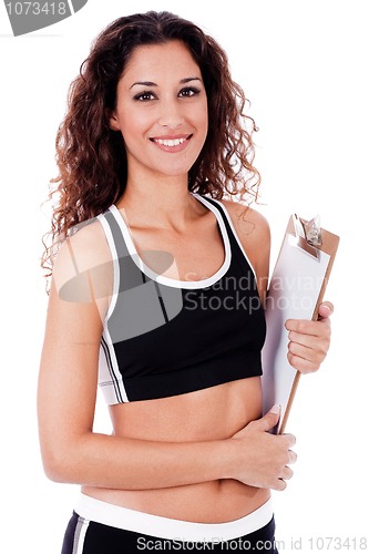 Image of Fitness woman holding a blank clip board
