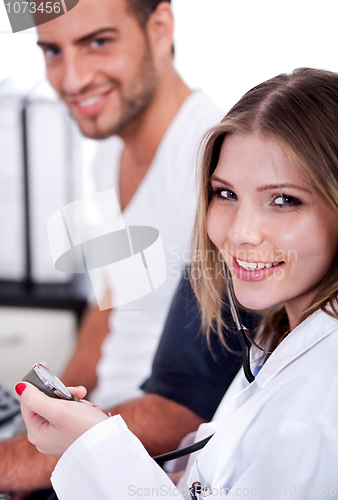 Image of Female doctor checking blood pressure