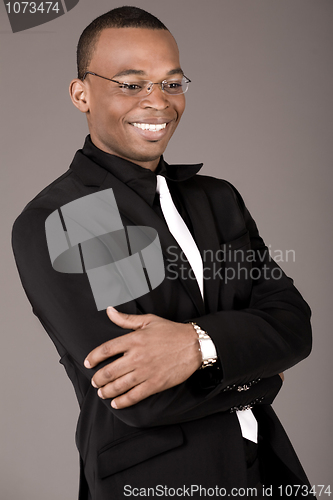 Image of Happy young african business man laughing