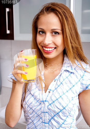 Image of Woman Drinking Orange Juice