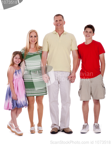 Image of happy family standing by holding their hands