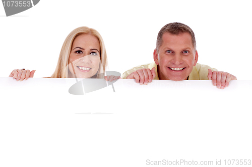 Image of Man and woman holding empty white board