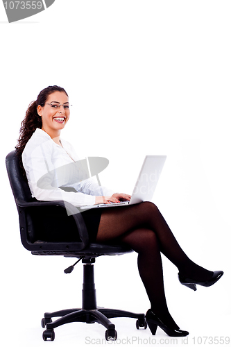 Image of Smiling business woman with laptop