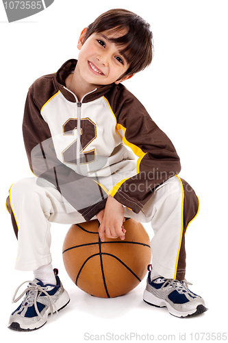 Image of Cute kid sitting on the ball