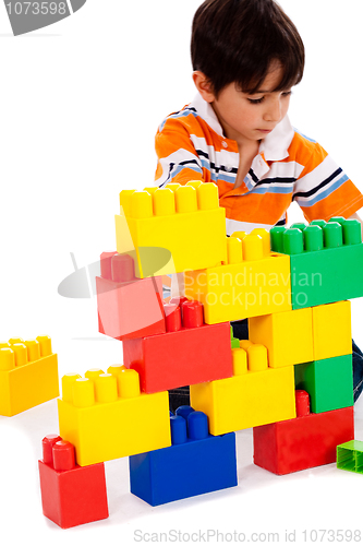 Image of Boy playing with building blocks