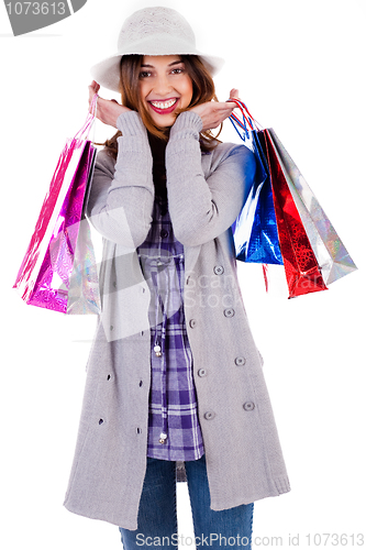 Image of happy lady posing with shopping bags