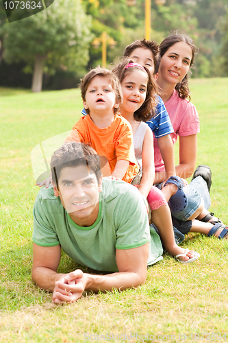 Image of Portrait of happy family looking at camera