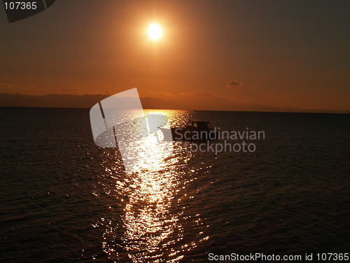 Image of yacht in sunrise