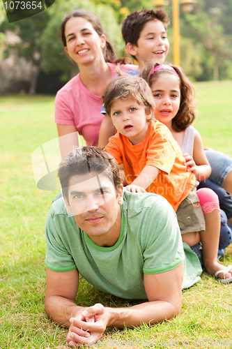 Image of Affectionate family enjoying outdoors