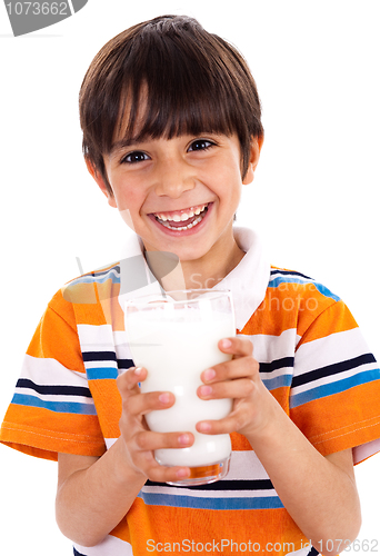 Image of Young kid holding a glass of milk