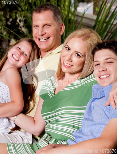 Image of Family outdoors smiling