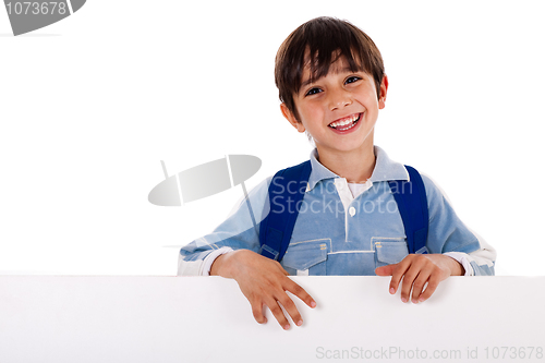 Image of Boy standing behind the blank board