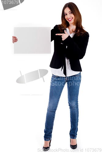 Image of young lady pointing at blank board