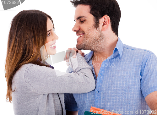Image of Beautiful couple smiling and facing each other