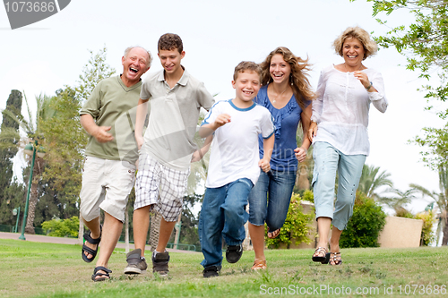 Image of Happy family enjoying outdoors