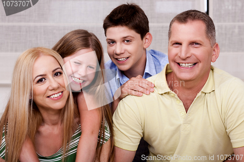 Image of Portrait of happy family of four